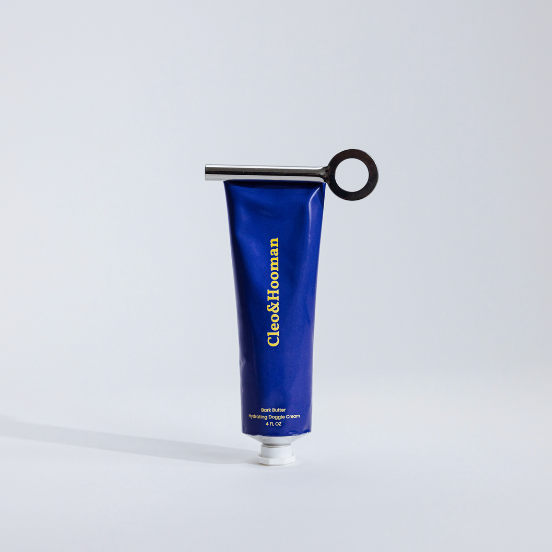 A blue tube of Bark Butter with a black twist cap, designed for dogs with dry or irritated skin.